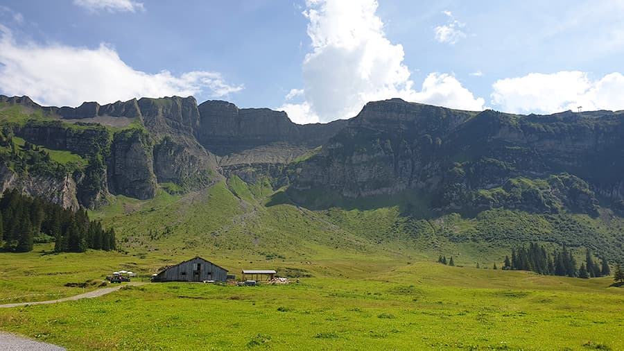 A small cabin in the Austrian alps, under a clear blue sky